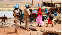 UN peacekeeping mission soldiers patrol on foot in the streets of Gao, Mali