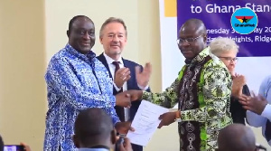 Alan Kyeremanten handing over the accreditation documents to GSA DG, Prof. Alex Dodoo