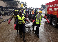 File photo: Rescue team carrying bodies of June 3 disaster victims