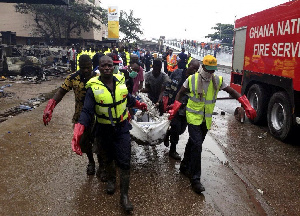 File photo: Rescue team carrying bodies of June 3 disaster victims