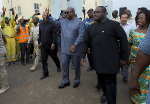 President Mahama, E. T Mensah [L] and  Sam George Nartey [R] arriving at the project site