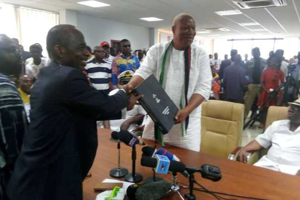 Alabi submitting his nomination form to the General Secretary of the NDC, Johnson Asiedu Nketia