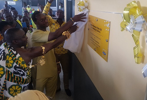 CEO of MTN, Selorm Adadevoh being assisted by the Juaso chief to officially commission the project