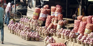 Some onions on display at a market