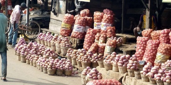 Some onions on display at a market