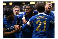 Chelsea players jubilate after securing a 4-2 victory against Leicester City