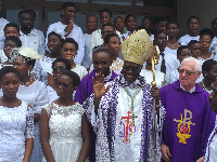 Archbishop Kwofie in a group photo with the priests and those who were confirmed at Christ the King