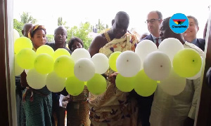 File photo; Kokrobite Chief cutting the sod with Acting Director for Economic Growth at USAID Ghana,