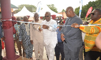 President of Groupe Ideal, Dr. Nii Kotei Dzani [in black] looks on as Mahama commissions the block