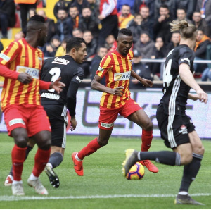 Bernard Mensah controls the ball as he tries to outwith his marker