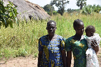 Pyerina Adong Otto (left) and family at her home in Awach, Uganda, PHOTO | THOMSON REUTERS FOUNDATIO