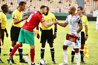 Black Stars captain, Dede Ayew (r) and  Morocco's Roman Saiss (L)