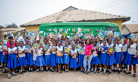 Some team members in a pose with the students