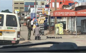 A military officer punishes a driver