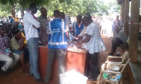 Electoral officials at a polling station.      File photo.