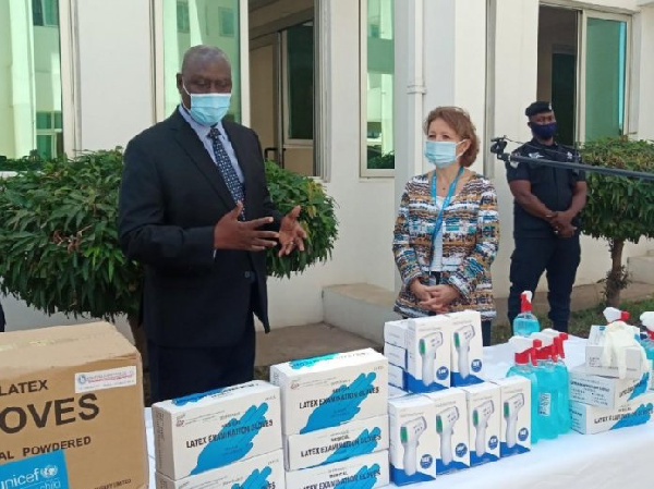 Madam Anne-Claire Dufay (right) presenting the PPEs to Mr Frank Raji (left) and Rev Kingsley Asare A