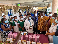 Frank Annoh-Dompreh presenting the items to the hospital