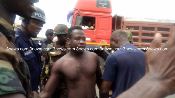 One of the persons arrested by the security team in the violent clash at Ahwiaa