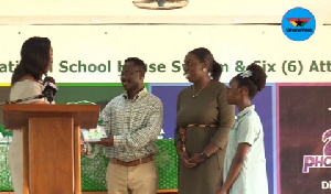 Nadia Bruce-Muller presenting the books to the reps of Pom-pom Library. Looking on is Ohemaa