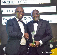 Archie Hesse recieving his award from Vice President Bawumia