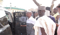 Kweku Baako (l) and Anas Aremeyaw Anas leaving the mosque for the burial grounds