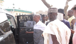 Kweku Baako (l) and Anas Aremeyaw Anas leaving the mosque for the burial grounds