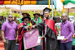 Seidu Joshua Adams receiving the prize