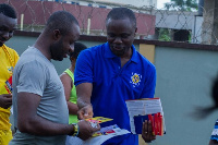 An ECG official interacts with a consumer