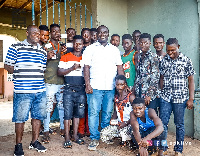 Davis Opoku Ansah (white shirt) in a group picture with some youth of Mpraeso