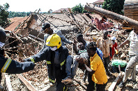 olice rescue team carry one of the survivors from the building that collapsed at Lukuli