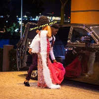 Kirk, helping his date, Nadia, out of the car