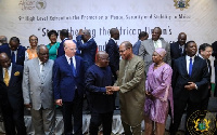 President Akufo-Addo in a handshake with Ibn Chambas