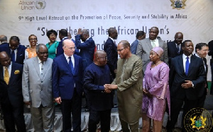 President Akufo-Addo in a handshake with Ibn Chambas