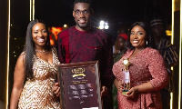 Mr Clottey and his team displaying the award