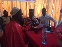 Public Relations Officer of AFROFIG, Mohammed Ibrahim Bari Diallo [Middle], addressing the press