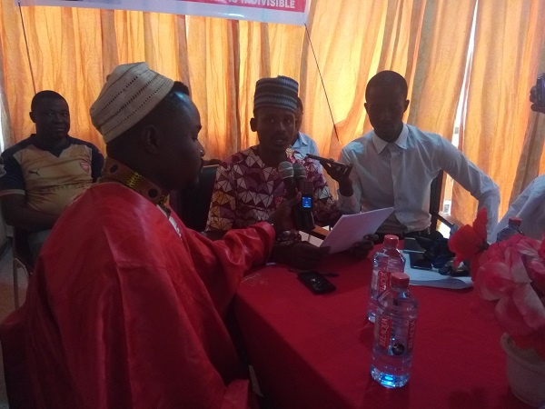 Public Relations Officer of AFROFIG, Mohammed Ibrahim Bari Diallo [Middle], addressing the press