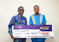 Bingobets CEO Dr Kobby Boateng with winner Charles Boateng