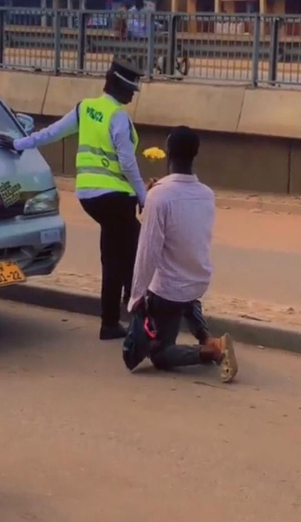 TikToker presenting the flowers to the police officer