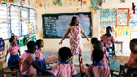 A teacher engages pre school kids