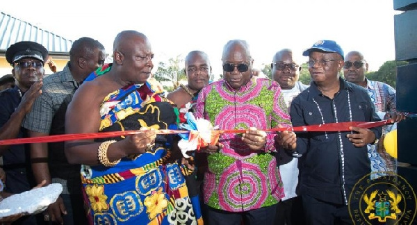 Torgbui Adzonugaga Amenya Fiti (L) and President Nana Akufo-Addo (R) cutting a ribbon