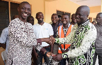 Deputy Regional Minister, Dr Samuel Nuertey Ayertey receives the keys from the MCE