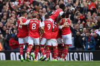 Arsenal players celebrate Partey's goal against Spurs