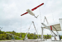 One of the Zipline drones positioned for a delivery