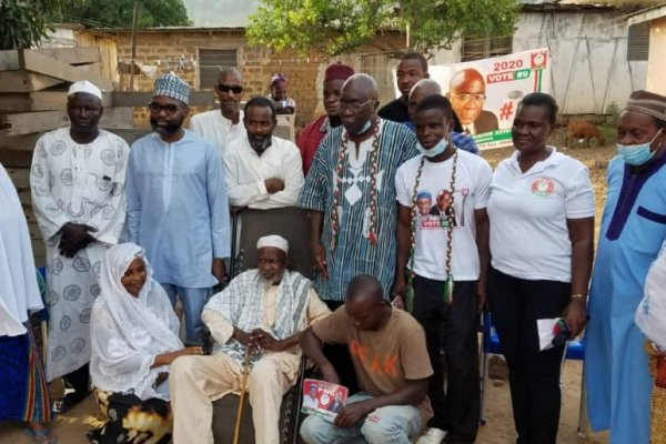 Reverend Dr. Divine Ayivor poses with the chief some community members