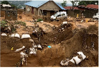 Damage inflicted after heavy rains caused floods and landslides