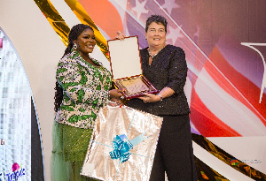 Eloina Baddoo Receiving AmCham Award.jpeg