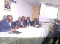 CEO of GIPC, Yofi Grant [left] and CEO of SADA Charles Abugre [middle] signing the MOU