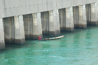 A fisherman fishing at the spillway of the Akosombo dam