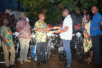 Herbert Krapa donating 5 motorbikes to the constituency