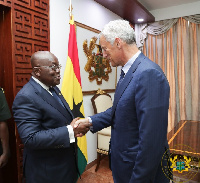 Bill Winters in a hand shake with President Akufo Addo